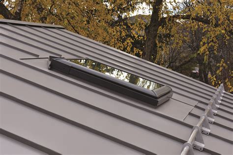 skylights for metal roofs on house|installing metal roofing around skylights.